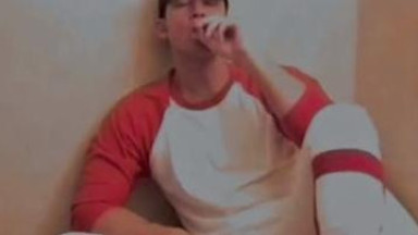 Baseball player smoking and stroking his dick