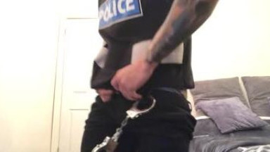 Horny cop strips and jerks off
