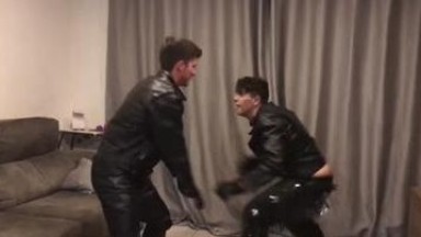 Guys fighting in leather