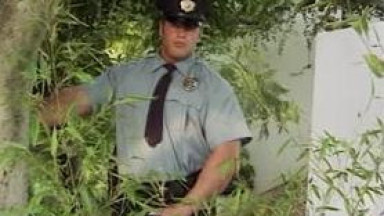 Bodybuilder is jerking and cop is watching