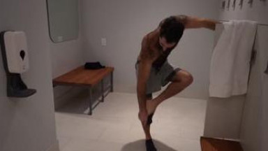 Hairy guy jerking after training