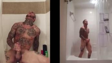 Tattooed guy jerks off in shower