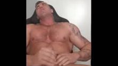 Sexy young bodybuilder flex