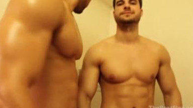 Handsome muscled hunks taking a shower