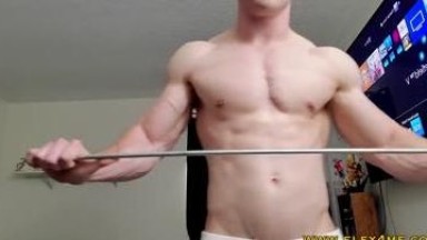 bodybuilder shows his strength